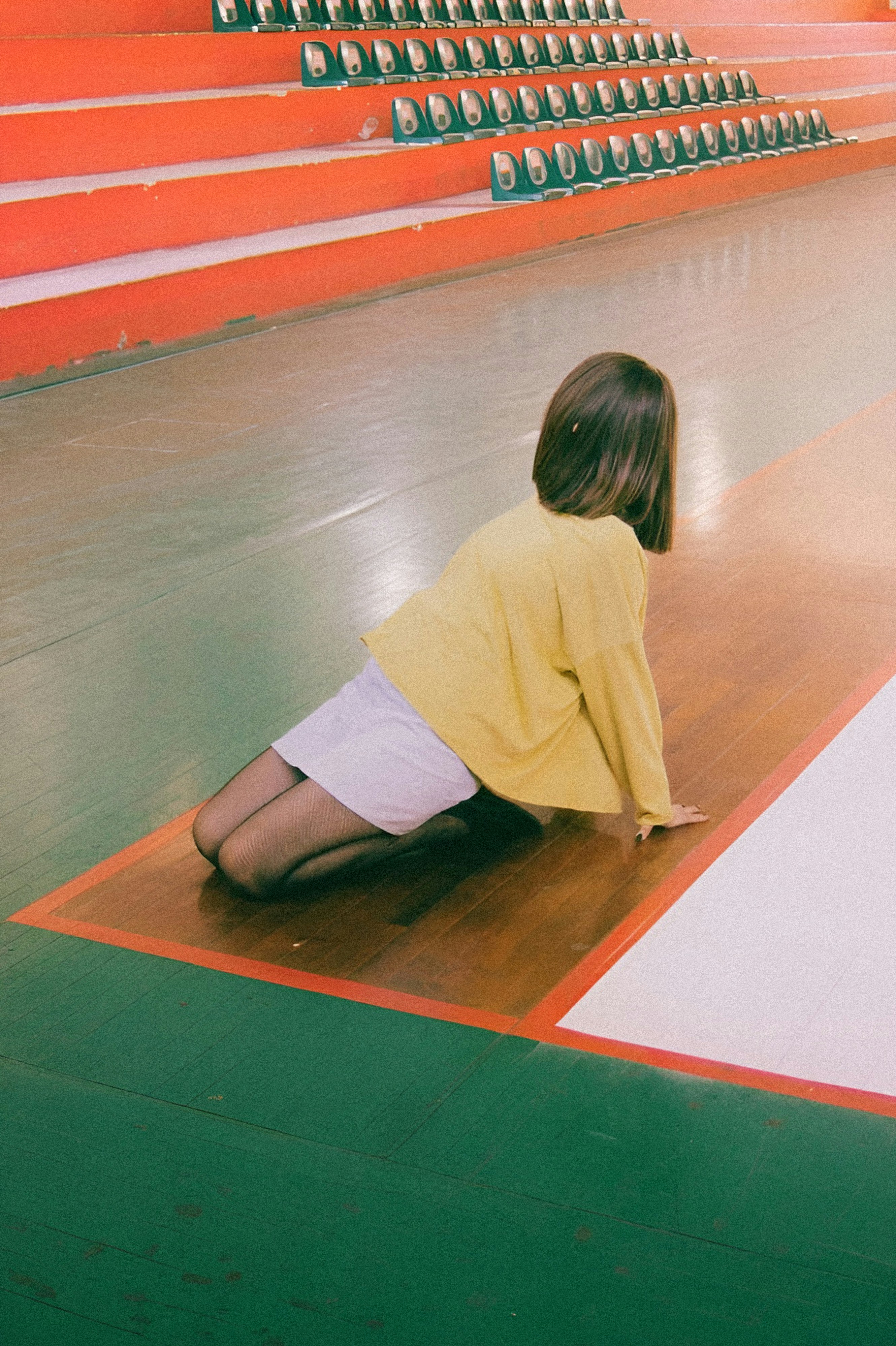 photograph of woman on gym floor